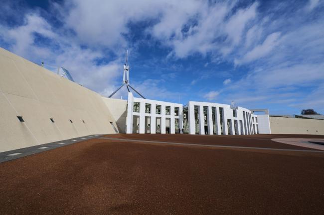 © Bloomberg. Parliament House in Canberra, Australia, on Saturday, Aug. 28, 2021. Over the years, Australia has increasingly legislated to curb foreign interference and acquisitions of critical infrastructure — moves widely seen as an attempt to contain Chinese influence. Photographer: Rohan Thomson/Bloomberg