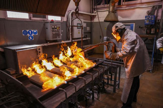 &copy Bloomberg. A worker pours molten gold into a mold during the casting of gold ingots at the JSC Krastsvetmet non-ferrous metals plant in Krasnoyarsk, Russia, on Monday, July 12, 2021. Gold headed for its second decline in three sessions as strength in the dollar and equities diminished demand for the metal as an alternative asset.