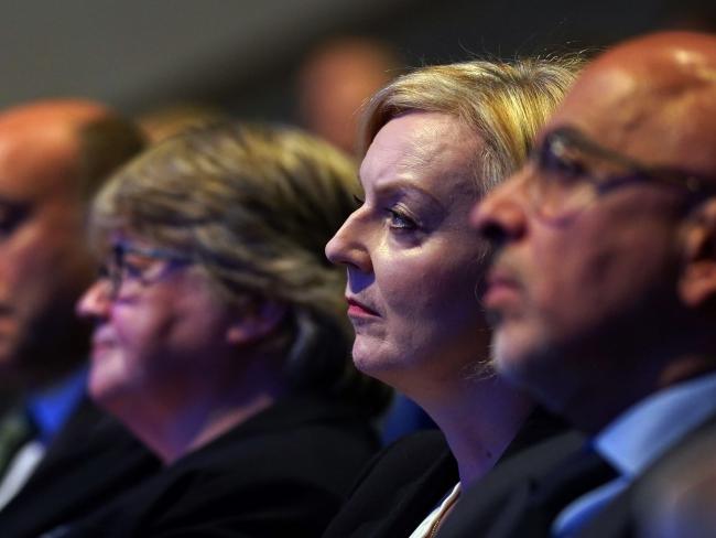 &copy Bloomberg. BIRMINGHAM, ENGLAND - OCTOBER 03: Secretary of State for Health and Social Care Thérèse Coffey (3rd R), British Prime Minister Liz Truss (2nd R) and Britain's Chancellor of the Duchy of Lancaster Nadhim Zahawi (R) watch Chancellor of the Exchequer Kwasi Kwarteng (not pictured) deliver a speech on day two of the annual Conservative Party conference on October 3, 2022 in Birmingham, England. This year the Conservative Party Conference will be looking at 