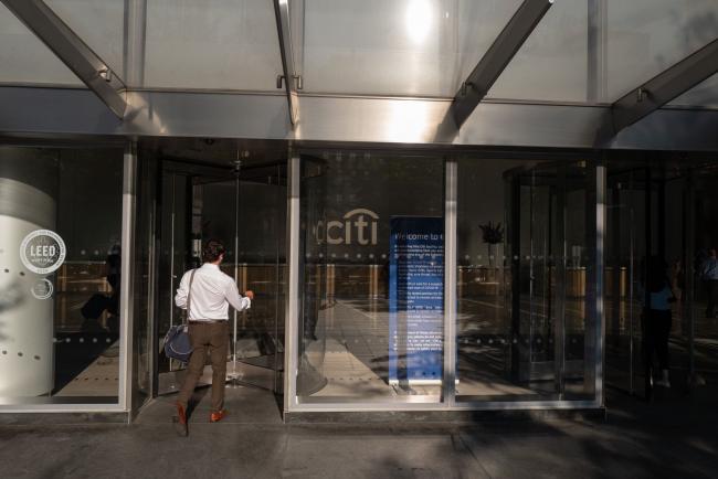 &copy Bloomberg. A worker enters Citigroup headquarters in New York, US, on Thursday, Aug. 4, 2022. Citigroup Inc. is planning a 500-person hiring spree over the next three years for a new wealth division catering to junior employees at private equity offices, consultancies and accounting firms, betting those clients will someday join the ranks of the ultra wealthy.