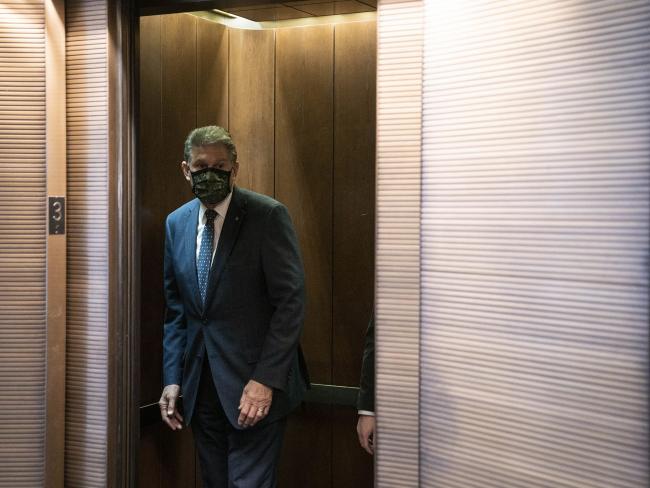 © Bloomberg. Senator Joe Manchin, a Democrat from West Virginia, boards an elevator near his office on Capitol Hill.