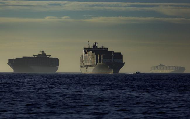 © Bloomberg. Container ships at anchor outside the Port of Los Angeles in Los Angeles, California, U.S., on Sunday, Nov. 21, 2021. Shipments to the Port of Los Angeles fell 8% year over year in October. Photographer: Tim Rue/Bloomberg