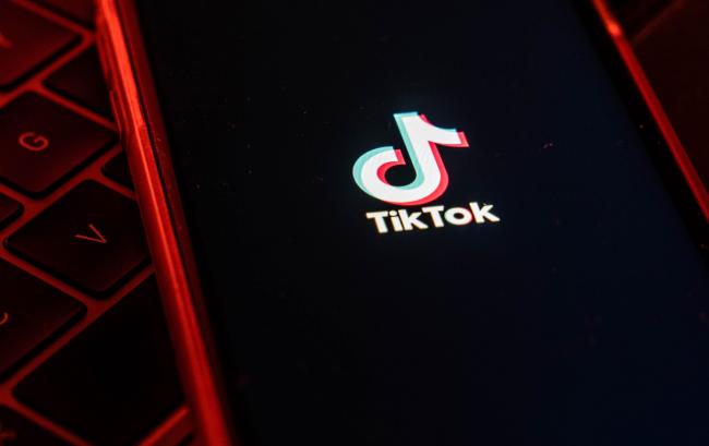 &copy Bloomberg. The logo for ByteDance Ltd.'s TikTok app is arranged for a photograph on a smartphone in Hong Kong.