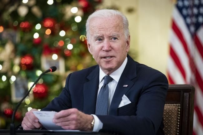 © Bloomberg. U.S. President Joe Biden speaks while meeting with members of the White House Covid-19 Response Team on the Omicron variant in the State Dining Room of the White House in Washington, D.C., U.S., on Thursday, Dec. 9, 2021. Covid-19 hospital admissions are rising quickly in many parts of the eastern U.S., including New Jersey and Connecticut, two weeks after U.S. residents gathered for the Thanksgiving holiday. Photographer: Al Drago/Bloomberg