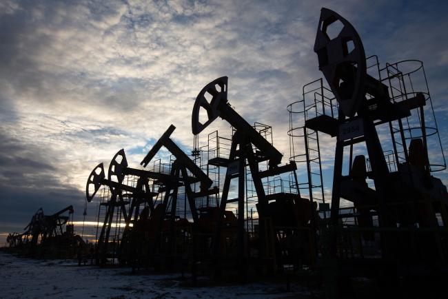 © Bloomberg. Oil pumping jacks, also known as 