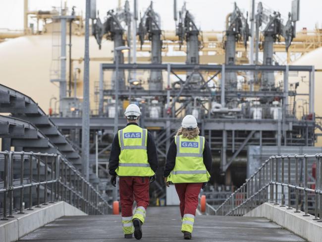 &copy Bloomberg. Employees cross a jetty towards the Gallina liquefied natural gas (LNG) tanker after docking at the National Grid Plc's Grain LNG plant on the Isle of Grain in Rochester, U.K., on Saturday, March 4, 2017. The shipment to England on the Gallina was priced using the U.K.'s National Balancing Point, where front-month gas cost about $7 a million British thermal units on Feb. 7. Photographer: Bloomberg/Bloomberg