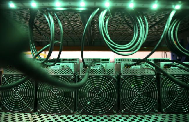 © Bloomberg. Cryptocurrency mining machines at a Canada Computational Unlimited Inc. computation center in Joliette, Quebec, Canada, on Friday, Sept. 10, 2021. CCU.ai, a Bitcoin mining center powered by hydroelectricity, has been conditionally approved for trading on the TSX Venture Exchange in Toronto under the stock symbol SATO. Photographer: Christinne Muschi/Bloomberg