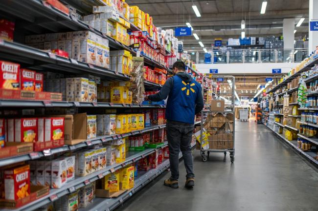 &copy Bloomberg. A worker stocks the shelves of a Walmart store in the Uptown Mall in Victoria, British Columbia, Canada, on Tuesday, July 26, 2022. Consumer price inflation accelerated in June to the highest level since January 1983, maintaining pressure on the Bank of Canada to continue delivering aggressive interest rate hikes. Photographer: James MacDonald/Bloomberg