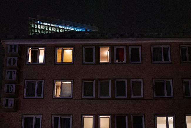 © Bloomberg. A partially lit hotel at night in Frankfurt, Germany, on Wednesday, July 27, 2022. Germany is set to bring some coal plants back online to keep the lights on this winter while higher power prices are contributing to record inflation and squeezing consumers as they struggle with higher bills.