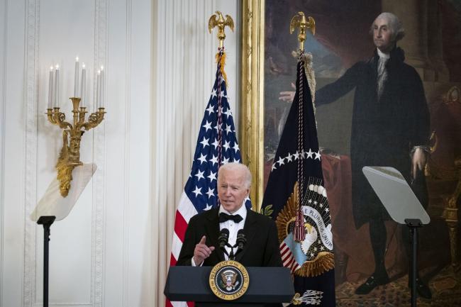 © Bloomberg. U.S. President Joe Biden speaks during the the Kennedy Center Honorees Reception in the East Room of the White House in Washington, D.C., U.S., on Sunday, Dec. 5, 2021. The John F. Kennedy Center for the Performing Arts 44th Honorees for lifetime artistic achievements include operatic bass-baritone Justino Diaz, Motown founder Berry Gordy, Saturday Night Live creator Lorne Michaels, actress Bette Midler, and singer-songwriter Joni Mitchell. Photographer: Al Drago/Bloomberg