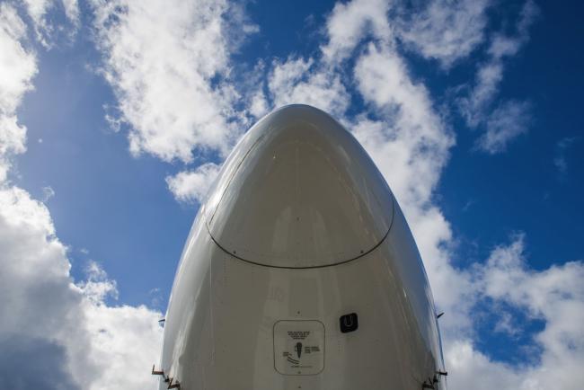 © Bloomberg. The nose cone of a Boeing Co 777-300ER passenger plane, operated by Air France-KLM, at Charles de Gaulle airport in Roissy, France, on Monday, May 10, 2021. European Union leaders urged U.S. President Joe Biden to lift restrictions on exports of Covid-19 vaccines to address the desperate needs of developing countries before embarking on complex discussions about whether patent waivers might also boost supply in the longer term.