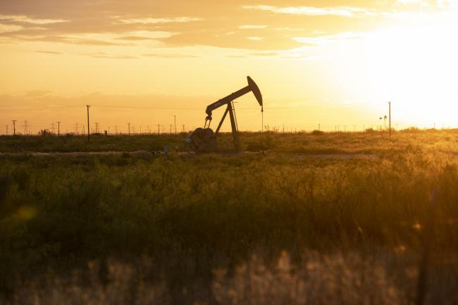 © Bloomberg. A pump jack operates just outside of Midland, Texas, U.S, on Friday, April 24, 2020. The price for the U.S. benchmark for crude oil, West Texas Intermediate, dropped below zero for the first time in history this month amid a global oil glut. Photographer: Matthew Busch/Bloomberg