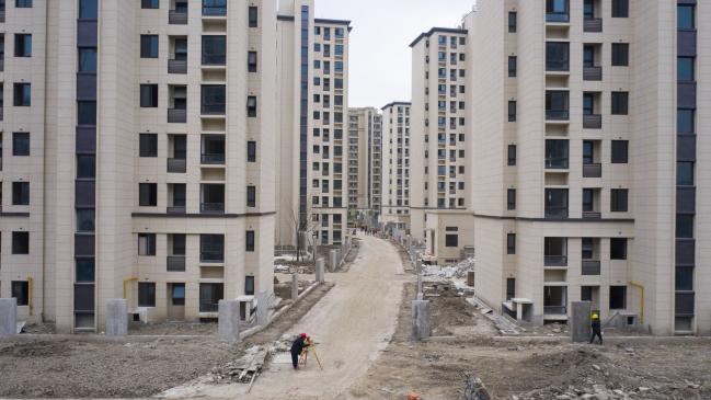 © Bloomberg. Kaisa Group Holdings Ltd.'s City Plaza development under construction in Shanghai, China, on Tuesday, Nov. 16, 2021. At least some of Kaisa's creditors haven't received bond interest that was due last week, according to people with knowledge of the matter, starting the clock on a 30-day grace period before a default. Photographer: Qilai Shen/Bloomberg