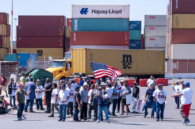 © Bloomberg. Truckers protest at the Port of Oakland in Oakland, California, US, on Monday, July 18, 2022. Truckers servicing some of the US's busiest ports are staging protests as state-level labor rules that change their employment status begin to go into effect, creating another choke point in stressed US supply chains.