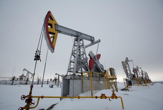 © Bloomberg. Oil pumping jacks, also known as 