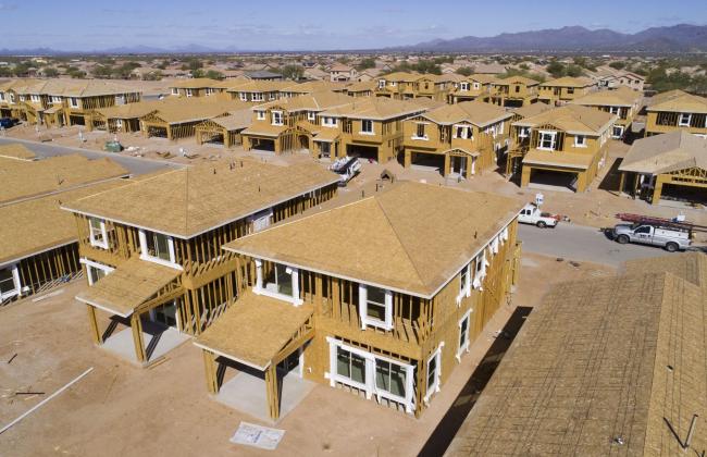 © Bloomberg. New homes under construction in Tucson, Arizona. Photographer: Rebecca Noble/Bloomberg