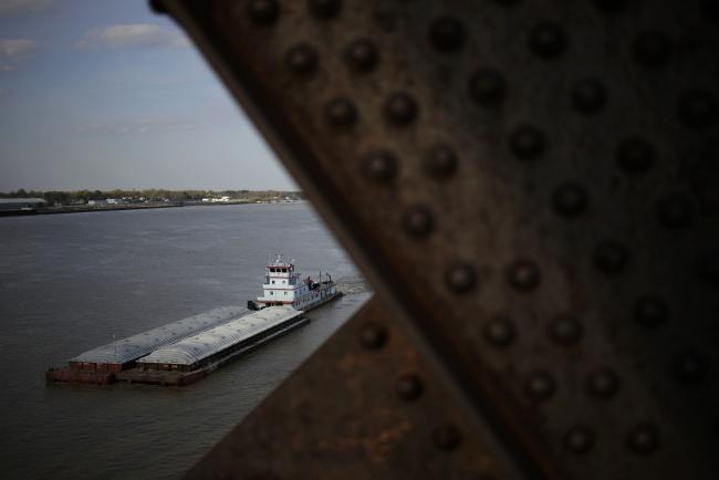 &copy Bloomberg. Barges travel along the Ohio River in Louisville, Kentucky, U.S., on Tuesday, April 6, 2021. US barge grain movements in the week ended March 6 totaled 848,441 tons, a 93% increase over the previous week and a 108% increase compared with the same period in 2020, according to the US Army Corps of Engineers.