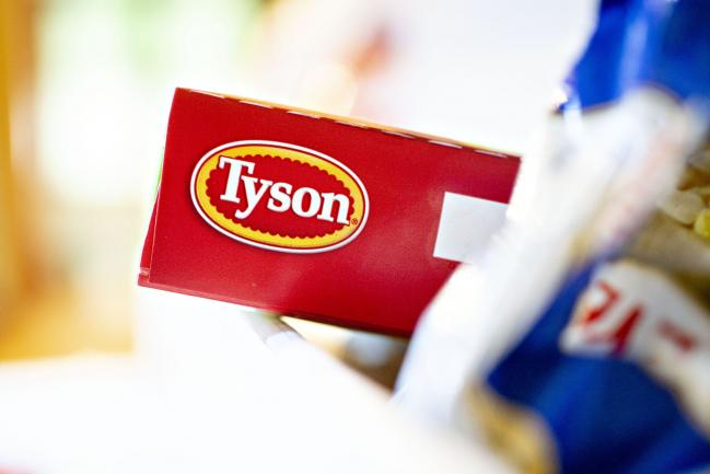 © Bloomberg. The Tyson Foods Inc. logo is seen on a box arranged for a photograph in Tiskilwa, Illinois, U.S., on Monday, Aug. 6, 2018. The largest U.S. meat company posted better-than-expected fiscal third-quarter earnings as beef demand rose and cattle costs fell, Tyson said Monday in a statement. Photographer: Daniel Acker/Bloomberg