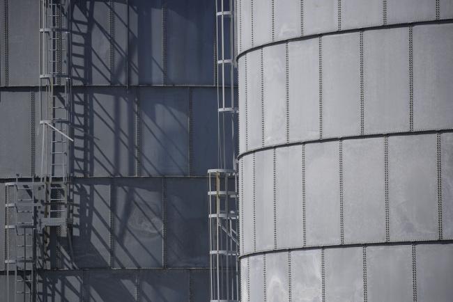 © Bloomberg. Storage tanks located near a dock for Hornbeck Offshore Services, Inc. oil industry support vessels in Port Fourchon, Louisiana, U.S., on Thursday, June 11, 2020. Oil eclipsed $40 a barrel in New York on Friday, extending a slow but relentless rise that’s been fueled by a pick-up in demand and could signal a reawakening for U.S. shale production. Photographer: Luke Sharrett/Bloomberg