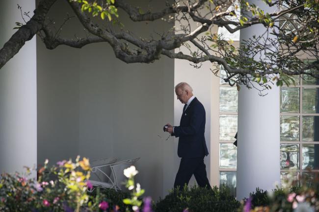 © Bloomberg. U.S. President Joe Biden walks past the Rose Garden to the Oval Office after speaking during the Council of Chief State School Officers' 2020 and 2021 State and National Teachers of the Year event at the White House in Washington, D.C., U.S., on Monday, Oct. 18, 2021. About one hundred teachers will be honored for their excellence in teaching and commitment to students' learning. Photographer: Al Drago/Bloomberg