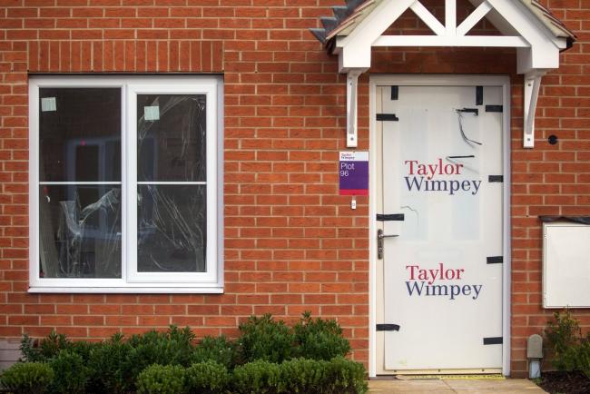 © Bloomberg. A plastic sheet on the door to a home under construction on a Taylor Wimpey Plc new housing development in Maldon, U.K., on Thursday, Jan. 21, 2021. House prices boomed during 2020, reaching a record high in December as a tax cut spurred Brits to upgrade their living situations after months of working from home.