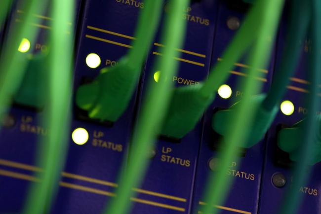 © Bloomberg. Ethernet cables inside a communications room at an office in London, U.K., on Monday, May 15, 2017. Governments and companies around the world began to gain the upper hand against the first wave of an unrivaled global cyberattack, even as the assault was poised to continue claiming victims this week. Photographer: Chris Ratcliffe/Bloomberg