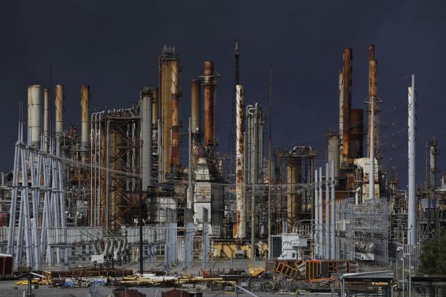 © Bloomberg. The Valero Energy Norco Refinery during a power outage caused by Hurricane Ida in LaPlace, Louisiana, U.S., on Monday, Aug. 30, 2021. Hurricane Ida barreled into the Louisiana coast on Sunday, packing winds more powerful than Hurricane Katrina and a devastating storm surge that threatens to inundate New Orleans with mass flooding, power outages and destruction. Photographer: Luke Sharrett/Bloomberg