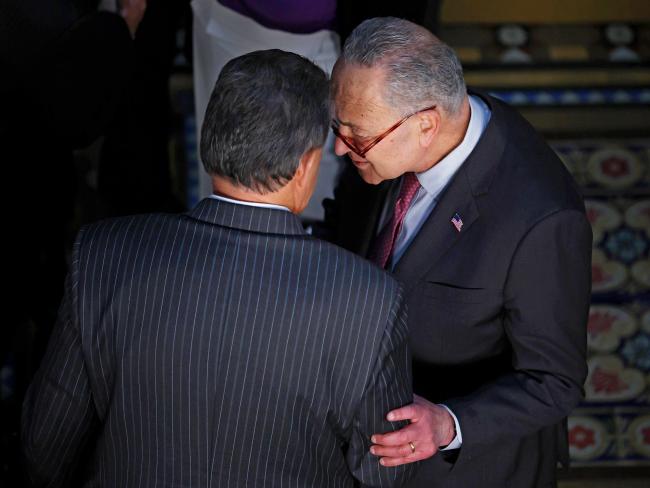 © Bloomberg. WASHINGTON, DC - MARCH 15: Sen. Joe Manchin (D-WV) (L) talks with Senate Majority Leader Charles Schumer (D-NY) before the ceremony where U.S. President Joe Biden signed the “Consolidated Appropriations Act