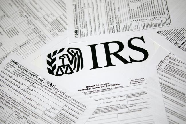 &copy Bloomberg. Internal Revenue Service 1040 Individual income tax forms for 2021 arranged in Louisville, Kentucky, U.S., on Tuesday, April 12, 2022. Refund sizes in some cases have been up by nearly 25% compared with last year due to pandemic relief programs and rising wages.