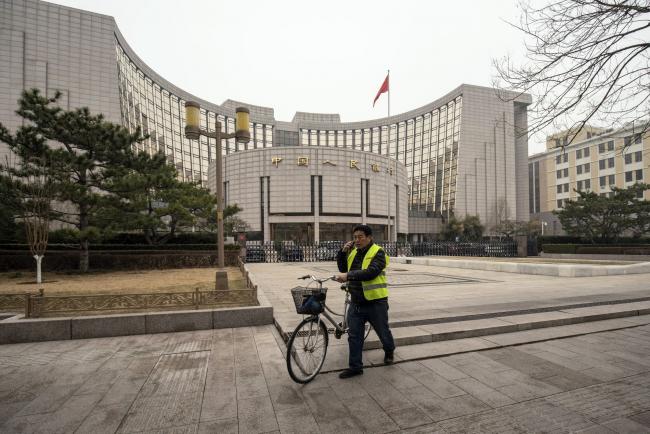 China’s Central Bank Signals Easing as Economic Growth Slows