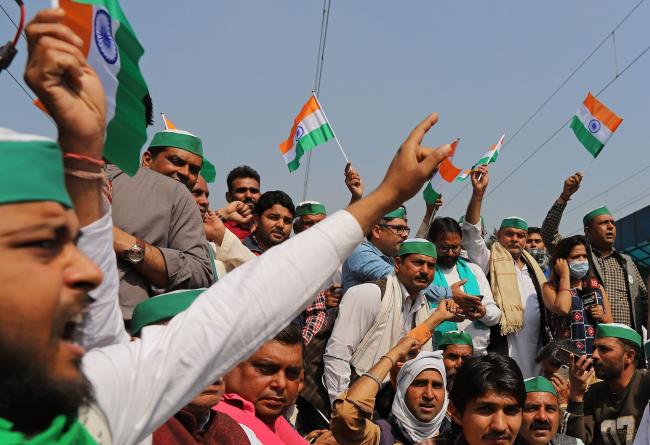 © Bloomberg. Farmers shout slogans while protesting at Modinagar railway station in Ghaziabad district, Uttar Pradesh, India, on Thursday, Feb. 18, 2021. The farmers are demanding India Prime Minister Narendra Modi repeals laws passed in September that they say will ruin their livelihoods. Photographer: Anindito Mukherjee/Bloomberg