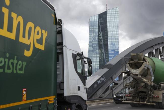 &copy Bloomberg. Trucks travel along a bridge over the River Main near the European Central Bank (ECB) headquarters in Frankfurt, Germany, on Thursday, Sept. 8, 2022. The ECB is on the brink of a jumbo three-quarter-point increase in interest rates to wrest back control over record inflation, even as the risk of a euro-zone recession rises. Photographer: Alex Kraus/Bloomberg