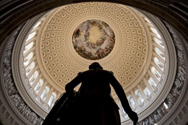 © Bloomberg. A statue of George Washington stands in the U.S. Capitol Rotunda in Washington, D.C., U.S., on Tuesday, Dec. 19, 2017.