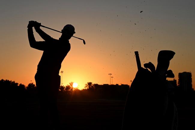 &copy Bloomberg. ABU DHABI, UNITED ARAB EMIRATES - JANUARY 17: A silhouette of Erik van Rooyen of South Africa as he warms up on the range ahead of his Round Two match during Day Two of the Abu Dhabi HSBC Championship at Abu Dhabi Golf Club on January 17, 2020 in Abu Dhabi, United Arab Emirates. (Photo by Ross Kinnaird/Getty Images)