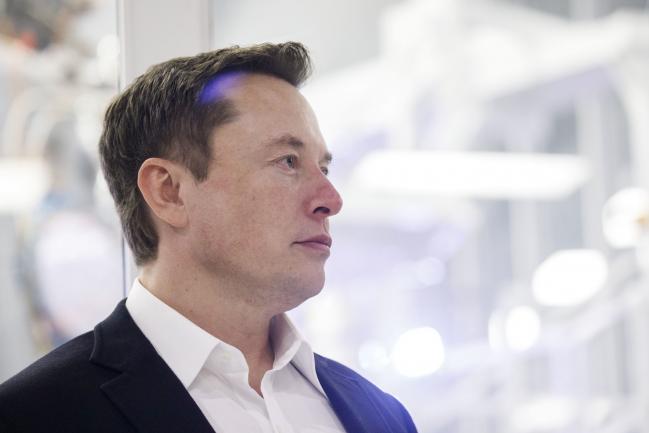 &copy Bloomberg. Elon Musk, chief executive officer of Space Exploration Technologies Corp. (SpaceX) and Tesla Inc., listens as Jim Bridenstine, administrator of the U.S. National Aeronautics and Space Administration (NASA), not pictured, speaks during an event at SpaceX headquarters in Hawthorne, California, U.S., on Thursday, Oct. 10, 2019. SpaceX’s Elon Musk and NASA Administrator Jim Bridenstine staged a public show of support for one another at the rocket company’s headquarters Thursday, weeks after the two traded barbs over the closely held company’s delayed efforts to fly astronauts for the first time. Photographer: Patrick T. Fallon/Bloomberg