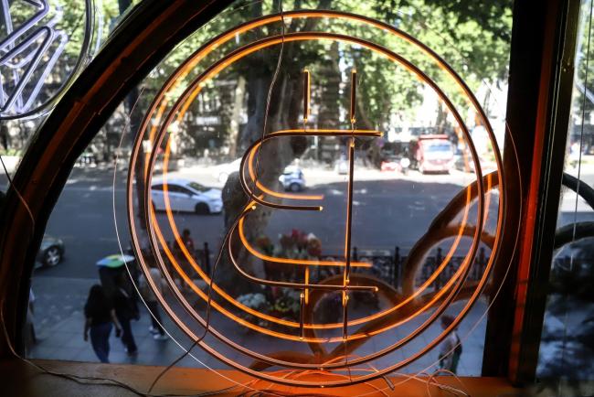 © Bloomberg. A bitcoin logo in the window of the Conexus Crypto currency exchange office in Tbilisi, Georgia, on Monday, July 25, 2022. A buzz is building in crypto-investor circles and on Twitter about Bitcoin’s stealth July rally, which has beleaguered investors starting to ponder whether the largest digital asset has found a bottom. Photographer: Valeria Mongelli/Bloomberg
