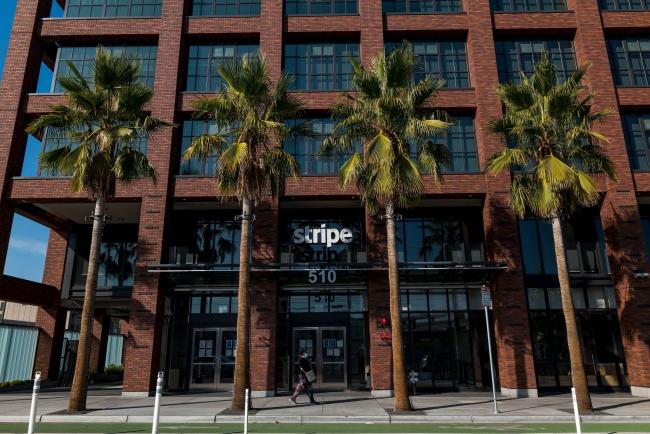 &copy Bloomberg. A pedestrian wearing a protective mask walks past Stripe Inc. headquarters in San Francisco, California, U.S., on Thursday, Dec. 3, 2020. Stripe will team up with some of the world's largest banks to offer checking accounts to businesses that sell their wares on e-commerce platforms such as Shopify Inc.