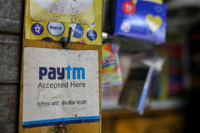 © Bloomberg. A store advertises the use of the Paytm digital payment system in Mumbai, India, on Saturday, July 17, 2021. Paytm, the Indian digital payments pioneer backed by SoftBank Group Corp., is seeking approval for a $2.2 billion initial public offering that could be India's largest. Photographer: Dhiraj Singh/Bloomberg