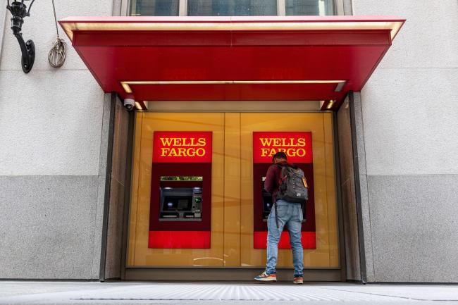&copy Bloomberg. A customer uses an automated teller machine (ATM) at a Wells Fargo bank branch in San Francisco, California, U.S., on Monday, July 12, 2021. Wells Fargo & Co. is expected to release earnings figures on July 14.