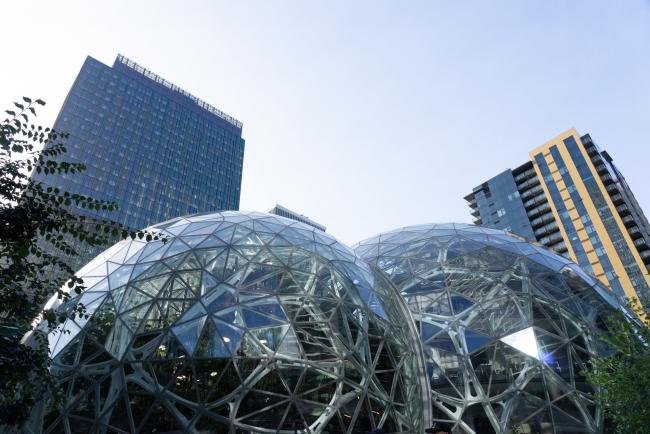 © Bloomberg. Amazon.com Inc. spheres stand at the company's headquarters in Seattle.