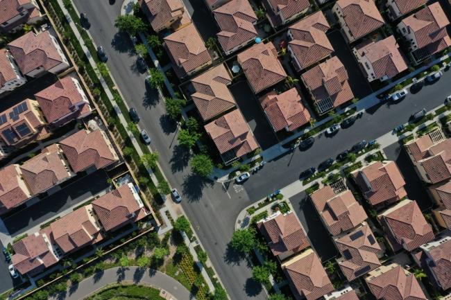 © Bloomberg. Homes stand in a planned residential community in this aerial photograph taken over Irvine, California, U.S., on Wednesday, May 6, 2020. Mounting economic fallout from the pandemic is fueling apartment landlords' concerns that more tenants will struggle to make their rent payments, even after most managed to come up with the money for April.