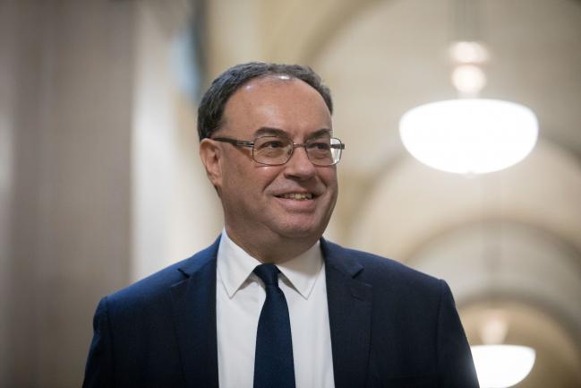 © Bloomberg. Andrew Bailey, governor of the Bank of England, poses for a photograph on his first day in the post at the central bank in the City of London, U.K., on Monday, March 16, 2020. Bailey knows a few things about crises, which should put him good stead on Monday when he takes the helm of the Bank of England as it tries to stave off recession triggered by the coronavirus pandemic.