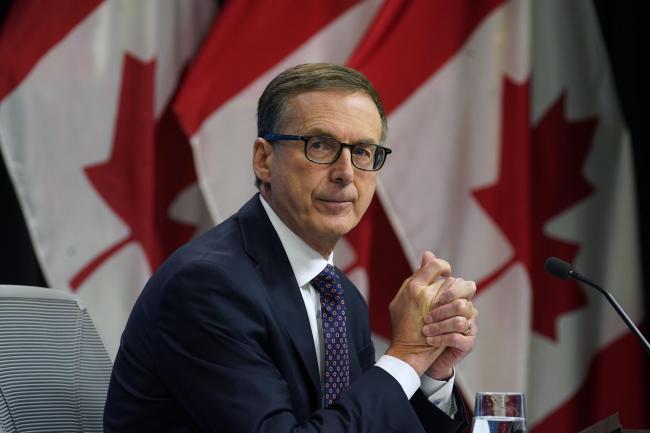 © Bloomberg. Tiff Macklem, governor of the Bank of Canada, listens during a news conference in Ottawa, Ontario, Canada, on Wednesday, Oct. 27, 2021. The Bank of Canada ended its bond-buying stimulus program and accelerated the potential timing of future interest rate increases amid worries that supply disruptions are driving up inflation. Photographer: Adrian Wyld/Canadian Press