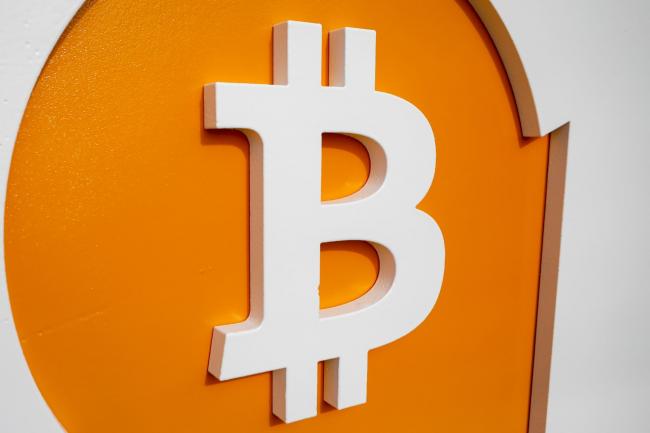 © Bloomberg. Bitcoin signage during the Bitcoin 2021 conference in Miami, Florida, U.S., on Friday, June 4, 2021. The biggest Bitcoin event in the world brings a sold-out crowd of 12,000 attendees and thousands more to Miami for a two-day conference.